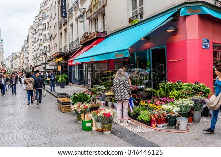 PARIS, FRANCE - JUNE 2, 2015: View of Rue Montorgueil - street in Montorgueil-Saint Denis-Les Halles district of Paris. Street is full of restaurants, cafes, bakeries, cheese shops, flower shopsâ?¦