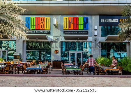 DUBAI, UNITED ARAB EMIRATES - SEPTEMBER 8, 2015: View restaurant in Dubai Marina. Marina - artificial canal city, there are a lot of restaurants, bars, cafes and shops.