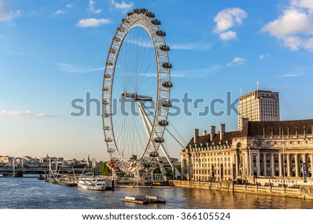 LONDON - JUNE 2, 2013: View of the London Eye at sunset. London Eye (135 m tall, diameter of 120 m) - a famous tourist attraction over river Thames in the capital city London.