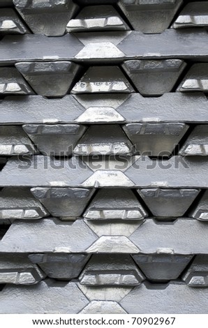 Stack of raw aluminum ingots in aluminum profiles factory