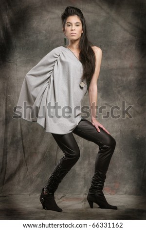 stock photo Model portrait in studio with avantgarde fashion