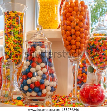Confectionery Sweet Shop Candies Displayed In Glass Jars And Vases. Square.