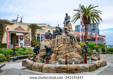 MONTEREY, CA - DEC 17, 2014: The Cannery Row Monument, featuring Literary Nobel Prize winner author John Steinbeck, a tourist attraction at historic 700 Cannery Row, Monterey, California Dec 17, 2014.