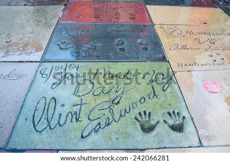 HOLLYWOOD, LOS ANGELES, CA -DEC 12: Movie stars handprints in TCL Chinese Theatre forecourt on Hollywood Boulevard Walk of Fame including Clint Eastwood, Morgan Freeman, and Tom Cruise, Dec 12, 2014.