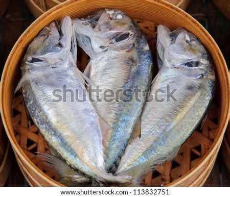 Mackerel fish in bamboo basket at market, Thailand