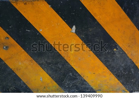 yellow and black road marking