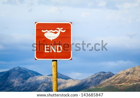 End of whales road sign