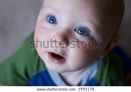 http://image.shutterstock.com/display_pic_with_logo/67744/67744,1159237727,1/stock-photo-baby-looking-up-in-wonder-big-blue-eyes-1902178.jpg