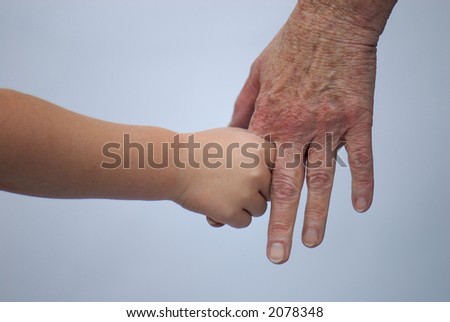 young and old holding hands