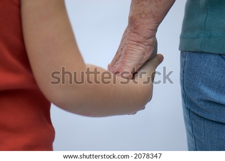 young and old holding hands