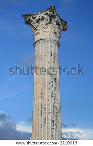 Ancient Roman Column with a Corinthian capital isolated on blue sky. Pompeii,Italy