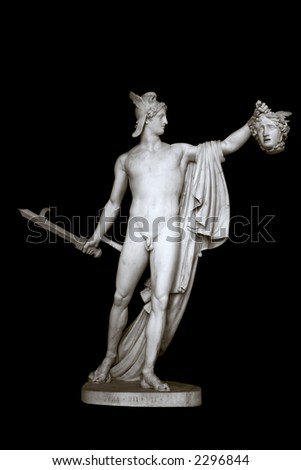 An ancient roman sculpture of Perseus with the head of Medusa.Isolated on black background with clipping path included