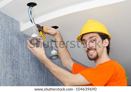 Electrician repairman working on refurbishment