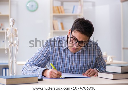 Medical student studying in classroom