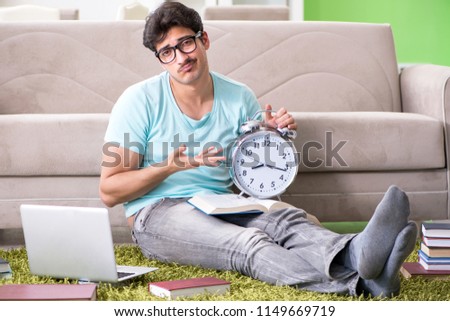 Student preparing for university exams at home in time managemen