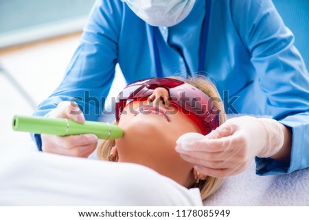 Woman visiting dermatologyst for laser scar removal