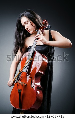 Woman cellist performing with cello