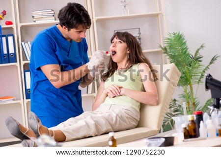 Doctor getting saliva test sample in clinic hospital