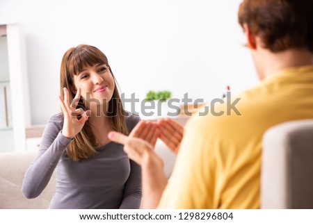 Woman and man learning sign language