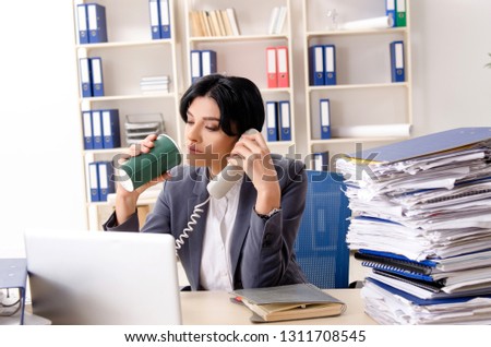 Middle aged businesslady unhappy with excessive work