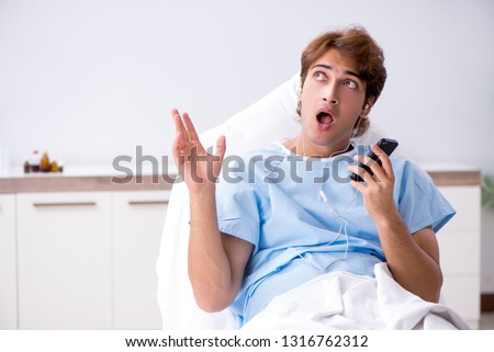 Young male patient lying on couch in hospital