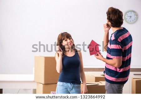 Young family moving to new house apartment