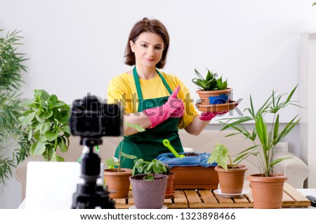 Female blogger explaining houseplants growing