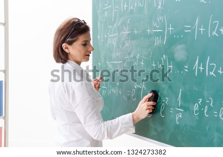 Female math teacher in front of the chalkboard