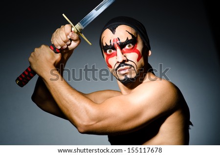 Man with sword and face paint