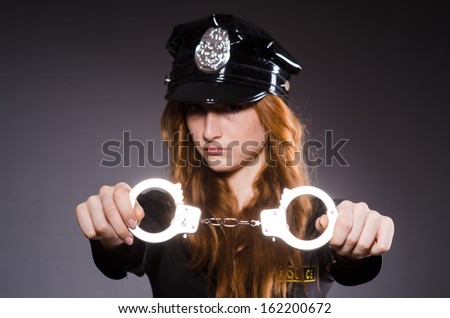 Woman police office in dark room