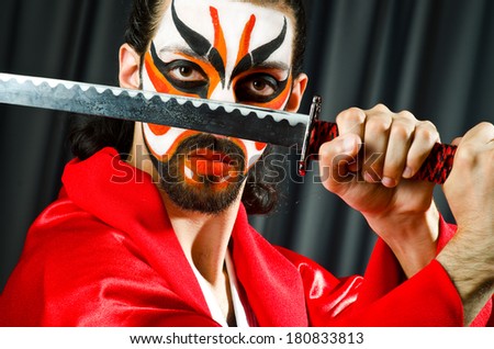 Man with sword and face mask
