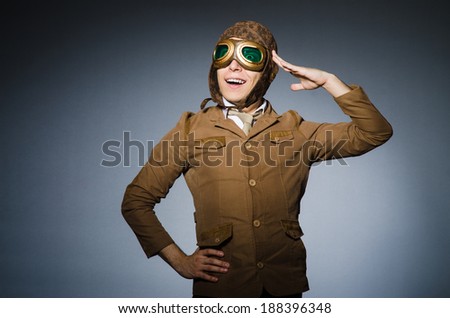 Funny pilot with goggles and helmet