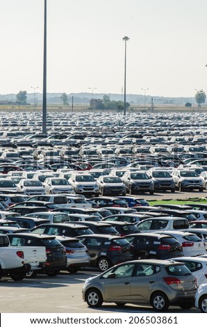 TUSCANY, ITALY - 27 June 2014: New cars parked at distribution center in Tuscany, Italy. This one of biggest distribution centers in Italy.