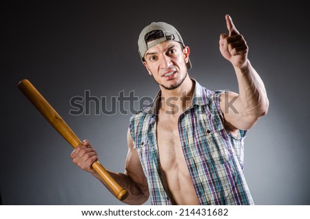 Violent man with baseball bat and hat
