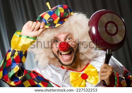 Angry clown with frying pan