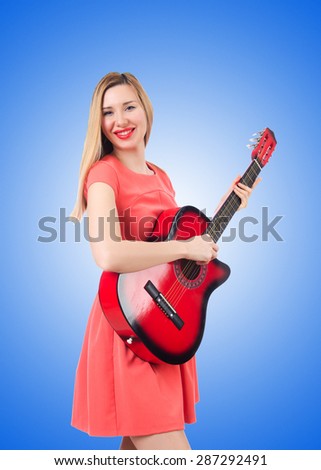 Female guitar player against the gradient