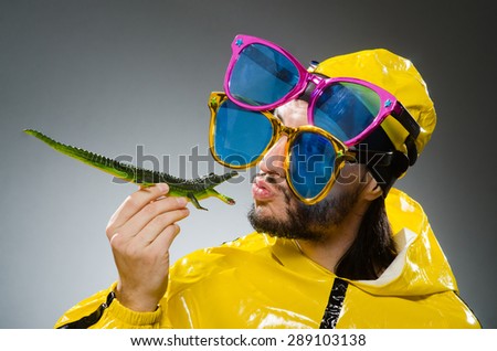 Man wearing yellow suit in funny concept