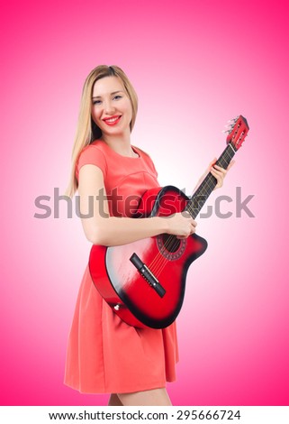 Female guitar player against the gradient