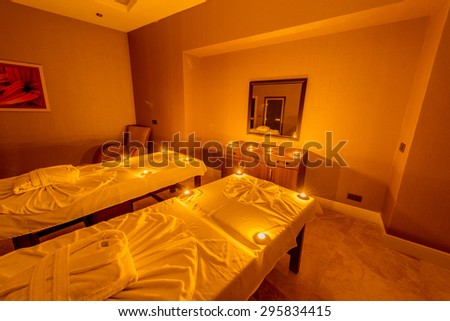 Spa room with burning candles