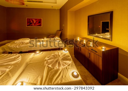 Spa room with burning candles