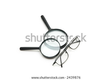 Magnifying glasses and reading glasses isolated on white