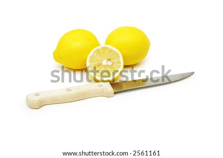 Lemons and knife isolated on white