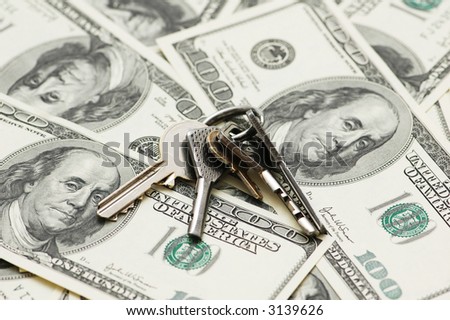House keys over the hundred dollar bank  notes