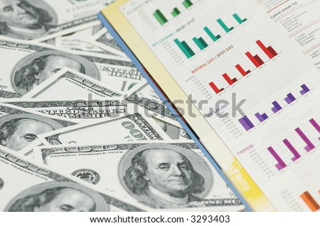 Business bar charts and hundred dollar notes