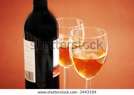 Two wine  glasses and a bottle of wine