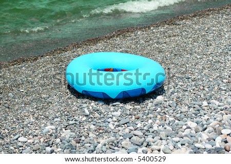 Ring buoy on the beach in summer