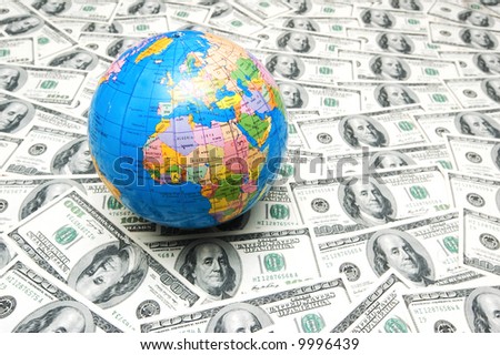 Globe over many american dollar bank notes