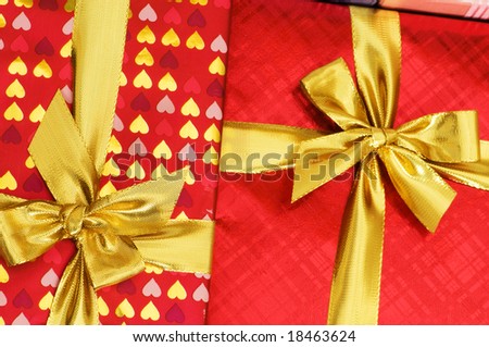 Close up of red gift box with golden ribbon