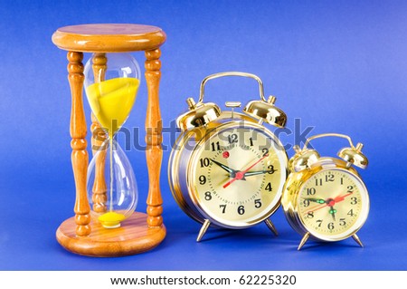 Time concept with clock and hour glass