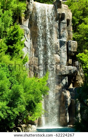 Tall waterfalls on the bright summer day